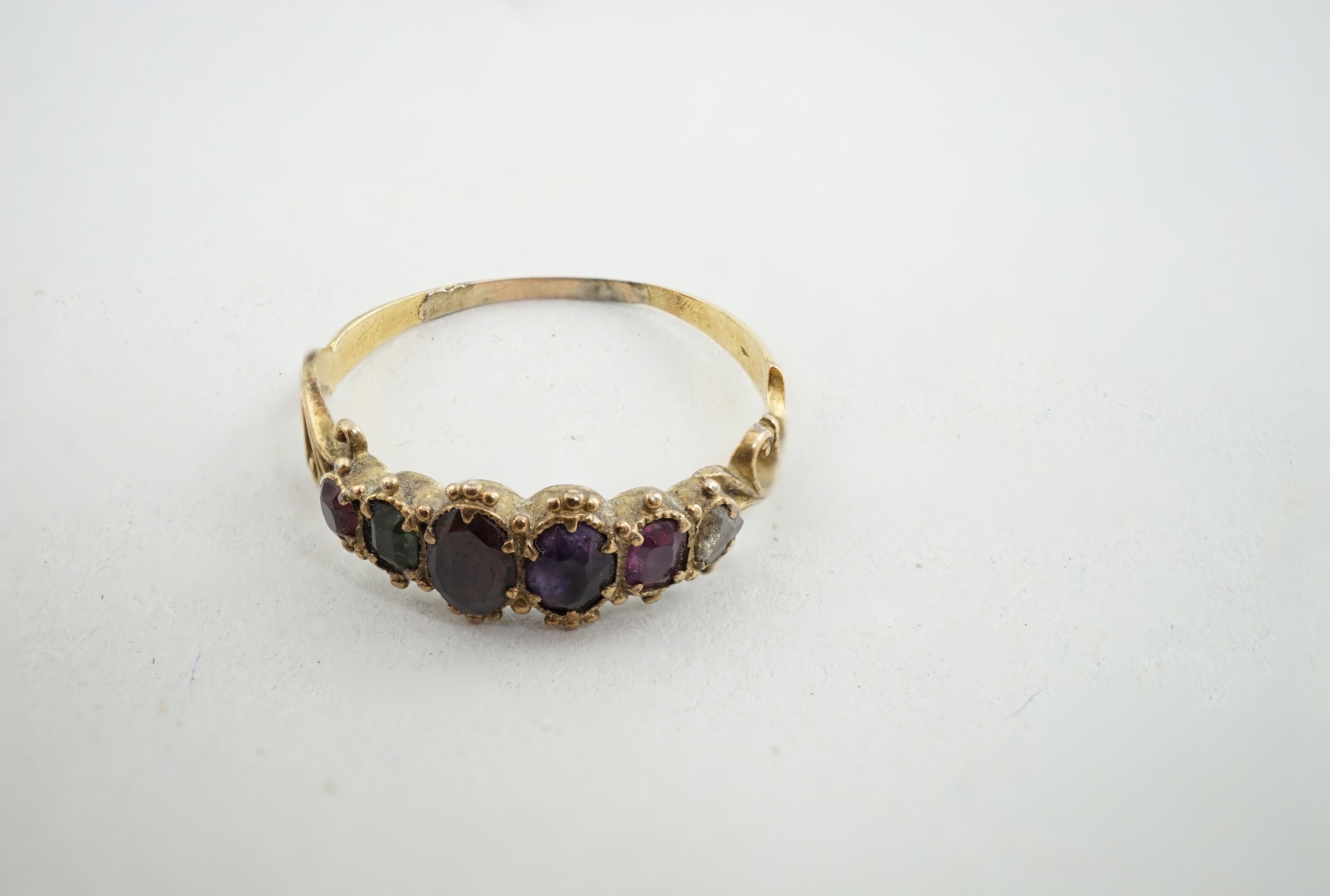 A Victorian gold and gem set 'Regard' half hoop ring